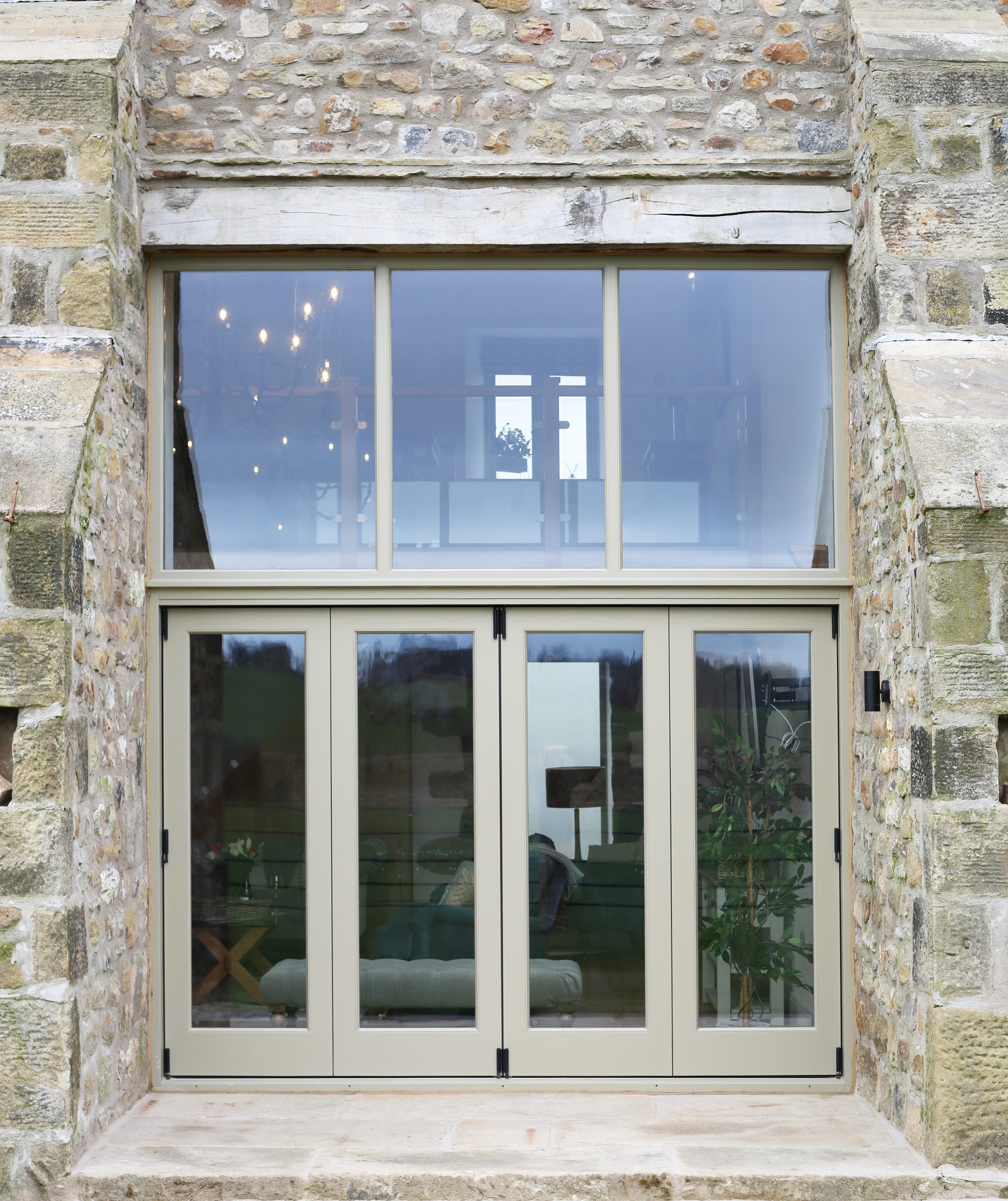A Set of Bespoke Timber Wooden Accoya Bifolding Doors using Centor System. Made in our Yorkshire Dales Workshop in Rylstone near Skipton, Ilkley, Harrogate and the Ribble Valley. Installed