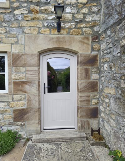 Bespoke Timber Accoya Feature Entrance Door with curved Head, Manufactured in our Rylstone Workshop near Skipton and Installed in Birstwith, Harrogate