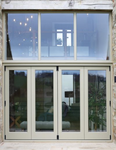 A Set of Bespoke Timber Wooden Accoya Bifolding Doors using Centor System. Made in our Yorkshire Dales Workshop in Rylstone near Skipton, Ilkley, Harrogate and the Ribble Valley. Installed in Airton, Craven, near Settle and Malham.