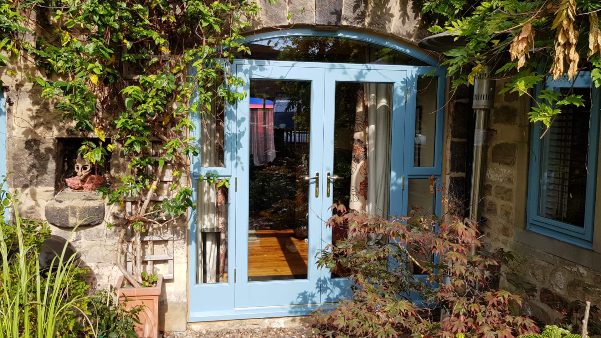 Bespoke Timber Accoya French Doors with Curved Head. Manufactured in our Rylstone Workshop, near Skipton & Ilkley. Installed in Addingham, Wharfedale near Yorkshire Dales.